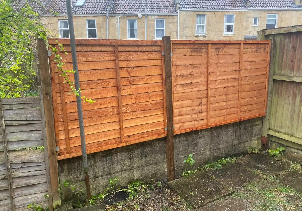 Complete garden boundary fence installation with secure posts and quality panels