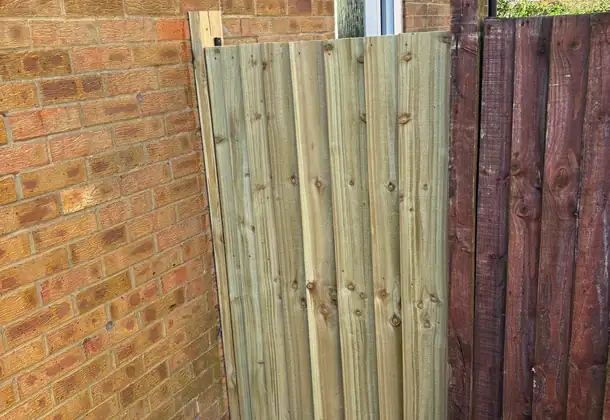 Quality fence repair showing attention to detail and matching materials