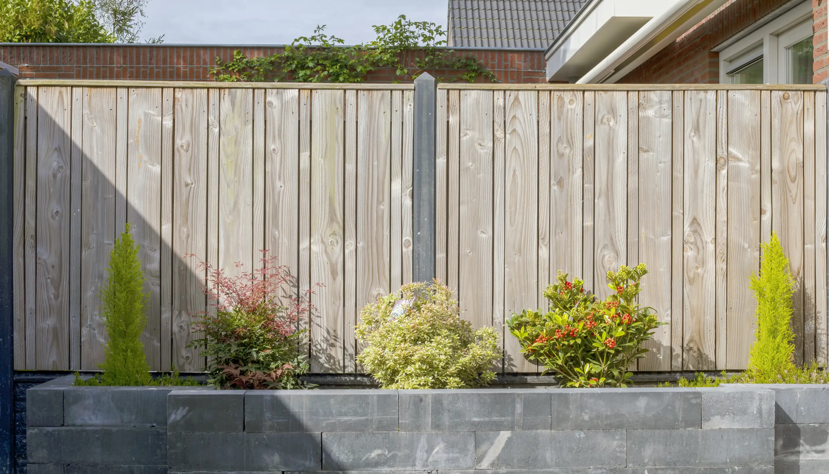 Professional fence installation and repair service in Bath showing newly installed garden boundary fencing