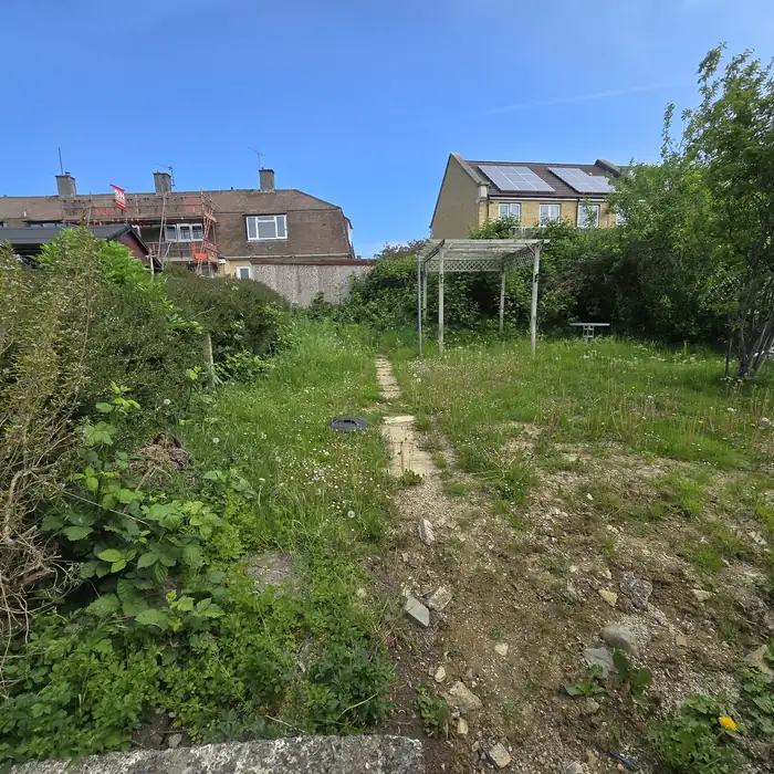 Garden with old shed and fencing before removal in Bath